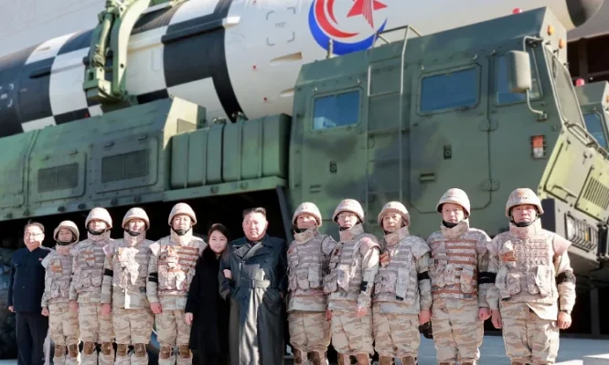 Kim Jong Un and his daughter attend a photo session with the scientists, engineers, military officials and others involved in the test-fire of the country's new Hwasong-17 intercontinental ballistic missile in this undated photo released on November 27, 2022 by North Korea's Korean Central News Agency (KCNA).-KCNA via REUTERS pic