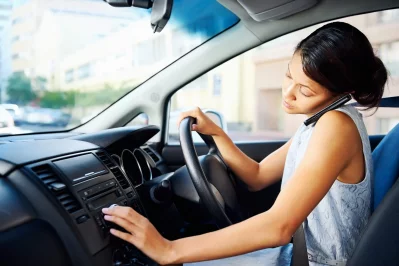 Talking on a smartphone while driving greatly increases the risk of car accidents. jpg