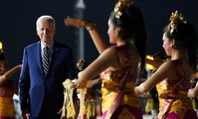 Joe Biden watches a cultural performance as he arrives at the Ngurah Rai International Airport 