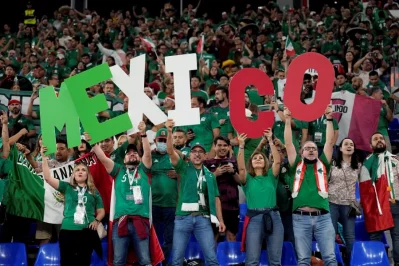 Fans of Mexico cheer during a World Cup group C soccer match against Poland - AP